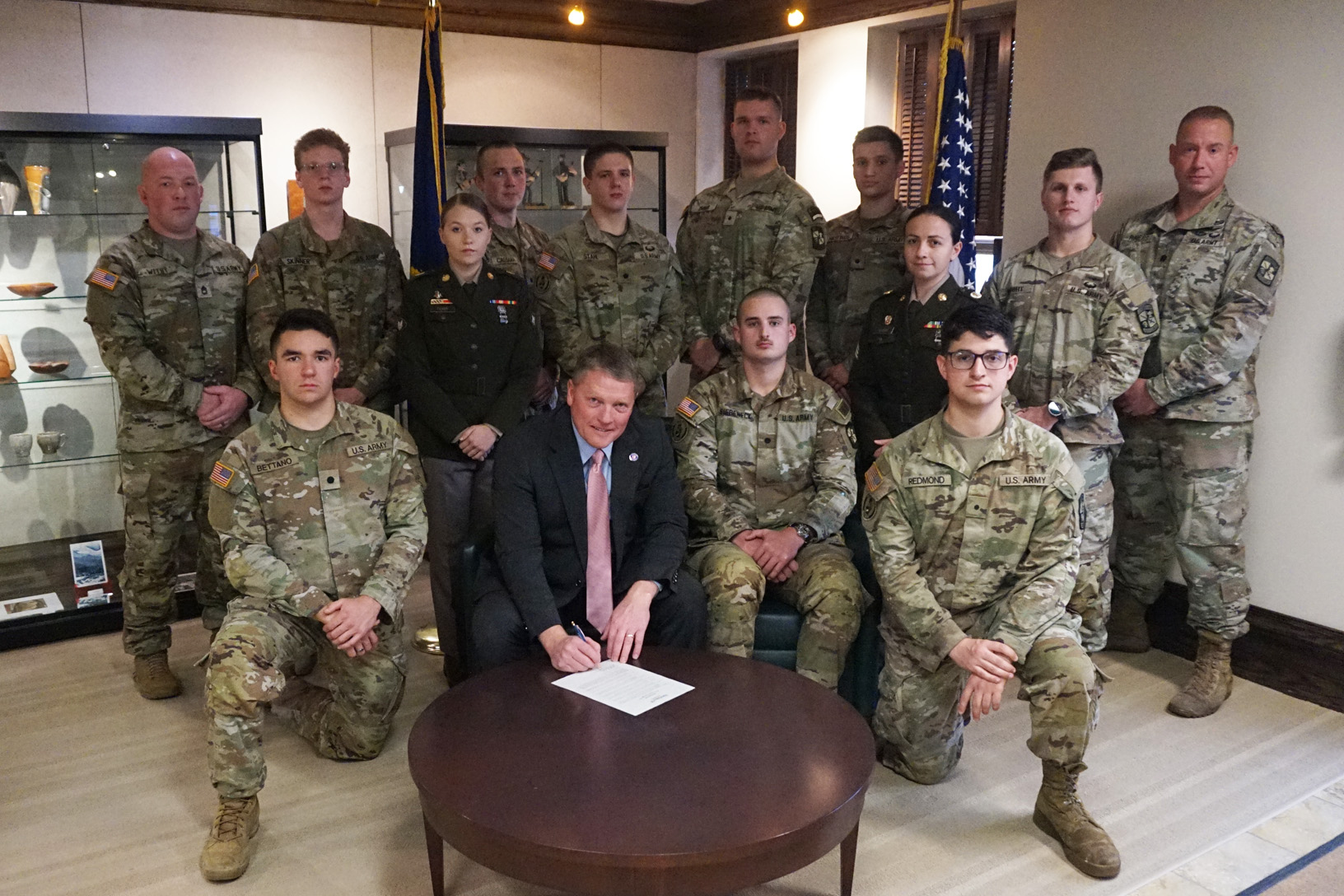 Dr. Jon Anderson signs a Military and Veterans Appreciation Week proclamation.