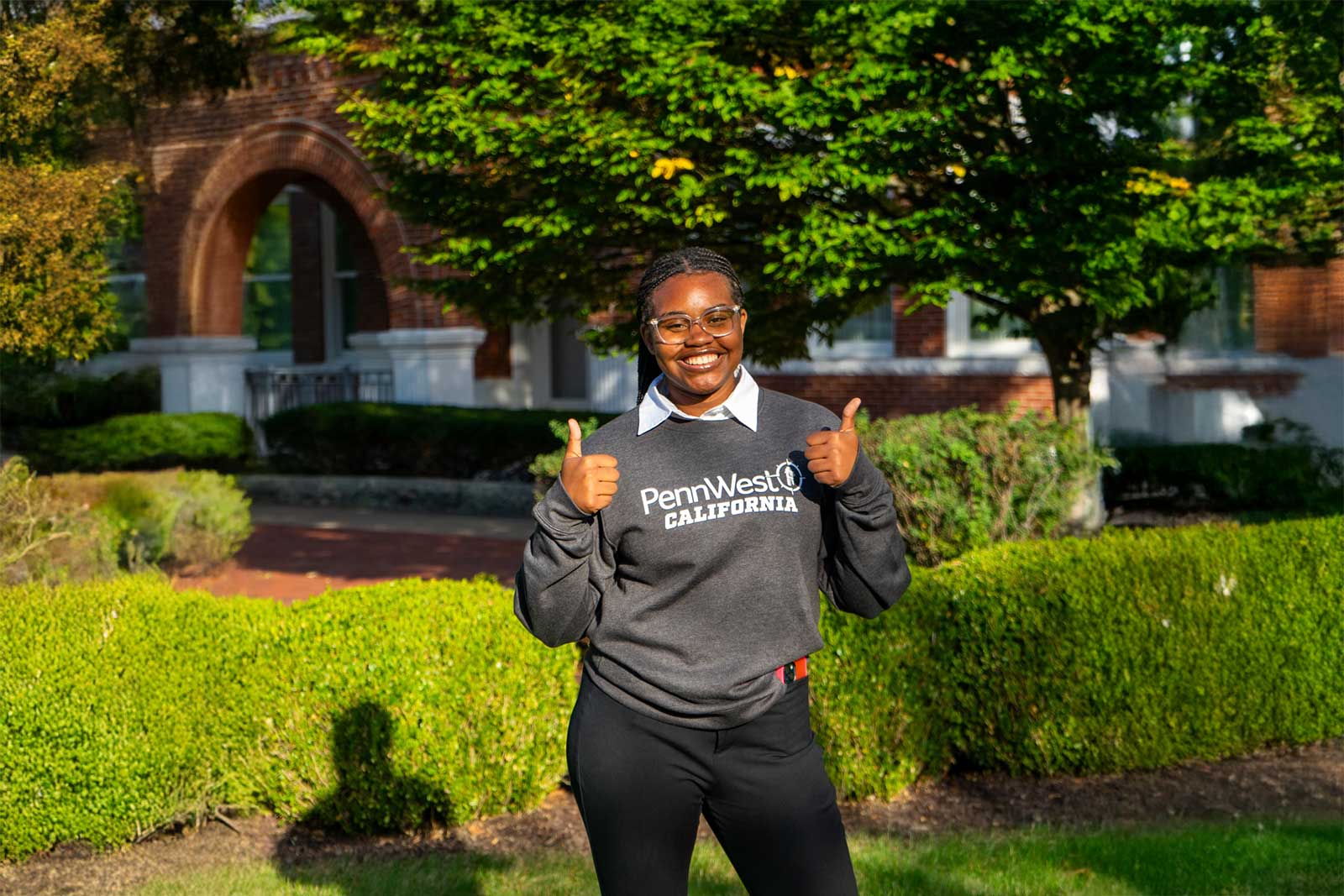 Jordyn Reynolds posing for a photo on the PennWest California campus.