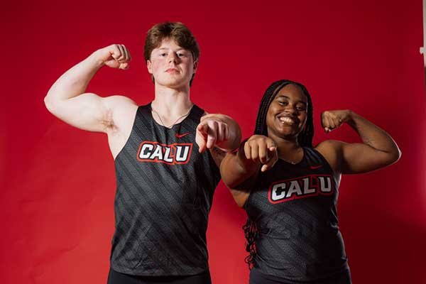 Jordyn Reynolds and a fellow student on a red background.